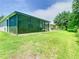 Scenic backyard with a large, screened-in patio offering an inviting outdoor space at 10875 Arbor View Blvd, Orlando, FL 32825