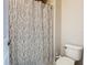 Cozy bathroom with a decorative shower curtain and white toilet at 10875 Arbor View Blvd, Orlando, FL 32825