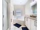 Bright bathroom with soaking tub, glass shower, and double vanity at 10875 Arbor View Blvd, Orlando, FL 32825