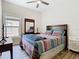 Comfortable bedroom with a queen-sized bed, ceiling fan and natural light at 10875 Arbor View Blvd, Orlando, FL 32825