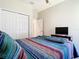 Bedroom with large closet and fan at 10875 Arbor View Blvd, Orlando, FL 32825