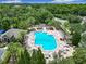 A community pool surrounded by lounge chairs and umbrellas provides a relaxing oasis for residents at 10875 Arbor View Blvd, Orlando, FL 32825