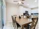 A dining room with a large wood table adjoins the kitchen area at 10875 Arbor View Blvd, Orlando, FL 32825