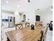Open floor plan with dining area transitioning to kitchen and living space at 10875 Arbor View Blvd, Orlando, FL 32825