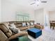 Living room with comfortable sectional sofa with view to dining area at 10875 Arbor View Blvd, Orlando, FL 32825