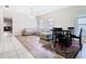 Open living room with hardwood floors, large sectional sofa, and modern light fixtures at 10875 Arbor View Blvd, Orlando, FL 32825