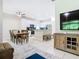 Open floor plan showcases dining area with transition to the kitchen and living space at 10875 Arbor View Blvd, Orlando, FL 32825
