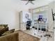 Bright office space with hardwood floors, a ceiling fan, and natural light at 10875 Arbor View Blvd, Orlando, FL 32825