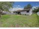 Spacious backyard with a well-maintained lawn and a view of the home's exterior at 126 Ingram Cir, Longwood, FL 32779