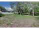 Expansive backyard with lush lawn and mature trees, offering plenty of space for outdoor activities at 126 Ingram Cir, Longwood, FL 32779