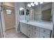 Bright bathroom with a white vanity, mirror and open access to the shower at 126 Ingram Cir, Longwood, FL 32779