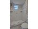 Shower with white tiling and an updated showerhead fixture at 126 Ingram Cir, Longwood, FL 32779