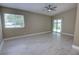 Bright bedroom with lots of natural light, vaulted ceilings, and sliding glass doors to the outdoor space at 126 Ingram Cir, Longwood, FL 32779