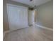 Bedroom featuring a large closet and an open doorway leading to a bathroom at 126 Ingram Cir, Longwood, FL 32779