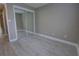 Bedroom featuring a mirrored closet and white tile flooring at 126 Ingram Cir, Longwood, FL 32779