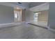 Inviting foyer with white door and wood floors, leading to the living area at 126 Ingram Cir, Longwood, FL 32779