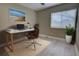Bright home office featuring a desk, comfortable chair, and natural light from the window at 126 Ingram Cir, Longwood, FL 32779