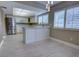 Modern kitchen with white cabinets, stainless steel appliances, and abundant natural light at 126 Ingram Cir, Longwood, FL 32779