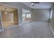 Open-concept living room featuring tile floors, views into the dining area and natural light at 126 Ingram Cir, Longwood, FL 32779