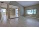 Bright living room with open floor plan featuring wood floors and large windows at 126 Ingram Cir, Longwood, FL 32779