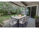 Relaxing outdoor patio featuring fire pit table, seating, and landscaped backyard, perfect for entertaining and enjoying serene views at 126 Ingram Cir, Longwood, FL 32779
