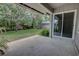 Covered patio area with sliding glass doors, perfect for outdoor relaxation and entertaining at 126 Ingram Cir, Longwood, FL 32779