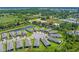 An aerial view of a cul-de-sac neighborhood with manicured lawns, established trees, and well-maintained exteriors at 1392 Lombardi Ct, Kissimmee, FL 34759