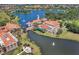 Aerial view of a resort community showcasing elegant architecture, waterways, and recreational amenities at 1392 Lombardi Ct, Kissimmee, FL 34759