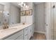 Bathroom with double sink vanity, neutral color palette, and stylish fixtures at 1392 Lombardi Ct, Kissimmee, FL 34759