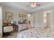 Comfortable bedroom featuring a desk area and access to a private bathroom at 1392 Lombardi Ct, Kissimmee, FL 34759