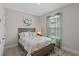 Bedroom with window and view to door to adjacent room at 1392 Lombardi Ct, Kissimmee, FL 34759