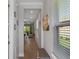 Hallway view of home with decorative mirrors leading to the dining and living areas at 1392 Lombardi Ct, Kissimmee, FL 34759