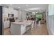 Spacious kitchen with white cabinets, stainless steel appliances, and a large center island with seating at 1392 Lombardi Ct, Kissimmee, FL 34759