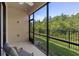 The screened in porch offers great views to the backyard at 1392 Lombardi Ct, Kissimmee, FL 34759