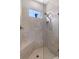 Modern shower with glass enclosure, built-in bench, and sleek fixtures at 1392 Lombardi Ct, Kissimmee, FL 34759