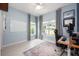 Light-filled bedroom with a large window and a neutral color palette at 141 W Main St, Lake Helen, FL 32744