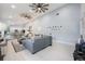 Open-concept living area with light wood floors, high ceilings, and seamless flow at 141 W Main St, Lake Helen, FL 32744