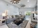Spacious living room with high ceilings, modern ceiling fans, and stylish decor at 141 W Main St, Lake Helen, FL 32744
