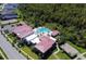 Aerial view showing the community center with pool, sport court, and surrounding residential area at 14366 Alafaya Oak Bnd, Orlando, FL 32828