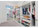 Spacious walk-in closet featuring custom shelving and ample storage for clothes and accessories at 14366 Alafaya Oak Bnd, Orlando, FL 32828