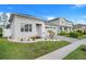 Beautiful single-story home with a manicured front yard and a brick paver driveway at 14366 Alafaya Oak Bnd, Orlando, FL 32828