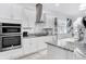 Well-equipped kitchen featuring granite countertops, stainless steel appliances, and ample white cabinetry at 14366 Alafaya Oak Bnd, Orlando, FL 32828