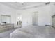 The main bedroom features a trey ceiling, light gray carpeting, and a view into the main bathroom at 14366 Alafaya Oak Bnd, Orlando, FL 32828