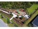 Aerial view of a playground and a dog park, both fenced in, within the community at 14366 Alafaya Oak Bnd, Orlando, FL 32828