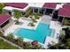 Aerial shot showcasing a large pool area with ample lounge space and palm trees at 14366 Alafaya Oak Bnd, Orlando, FL 32828