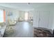 Bright living room with hardwood floors, a comfy sofa, and natural light at 1713 Redfin Way, Kissimmee, FL 34759