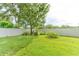 Large, fenced backyard with mature trees and lush green grass at 1862 Lorenzo Ln, Oviedo, FL 32765