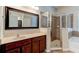Bathroom showcasing a shower, vanity, sink, and framed mirror at 1862 Lorenzo Ln, Oviedo, FL 32765