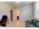 Bedroom with ample natural light and wood flooring, features an ensuite bathroom at 1862 Lorenzo Ln, Oviedo, FL 32765