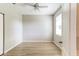 Well lit bedroom with a ceiling fan and laminate flooring at 1862 Lorenzo Ln, Oviedo, FL 32765